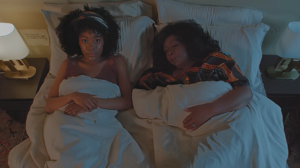 Peace and Donna lying awake in the same bed